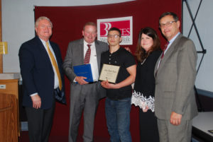 Alex Obert-Thorn (center) is congratulated by (from left) BOCES COO Michael Flynn, Principal Daniel Loughran, Executive Director Nancy Kelsey and Board President Peter Wunsch.