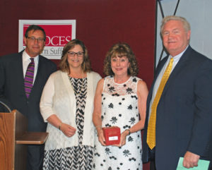 Carol Vogt, second from right, receives an Outstanding Achievement Award