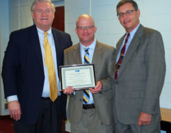 Dr. Timothy Eagen (center), Superintendent of the Kings Park School District, accepts a Proclamation of Appreciation from Western Suffolk BOCES Chief Operating Officer Michael Flynn (left) and Board of Education President Peter Wunsch for his district’s support of the External Diploma Program.