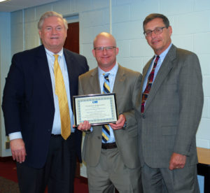 Dr. Timothy Eagen (center), Superintendent of the Kings Park School District, accepts a Proclamation of Appreciation from Western Suffolk BOCES Chief Operating Officer Michael Flynn (left) and Board of Education President Peter Wunsch for his district’s support of the External Diploma Program.