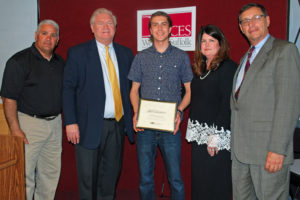 Jack Vaccaro (center) is congratulated by (from left) Culinary Arts teacher Chef Robert Scavo, COO Michael Flynn, Executive Director Nancy Kelsey and Board President Peter Wunsch.
