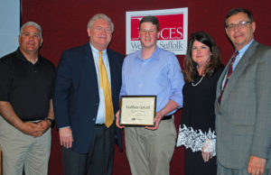 Matthew Garcett (center) is congratulated by (from left) Culinary Arts teacher Chef Robert Scavo, COO Michael Flynn, Executive Director Nancy Kelsey and Board President Peter Wunsch.