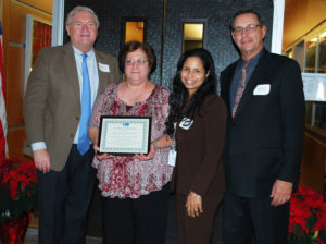 West Babylon Board of Education President Lucy Campasano (second from left) and Superintendent Dr. Yiendhy Farrelly (third from left) accept a Proclamation of Appreciation from Western Suffolk BOCES Chief Operating Officer Michael Flynn (left) and Board of Education President Peter Wunsch for his district’s support of the External Diploma Program.